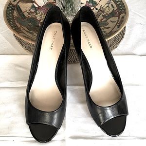 Cole Haan black leather peep toe pumps with polished wood heels, size 8.5
